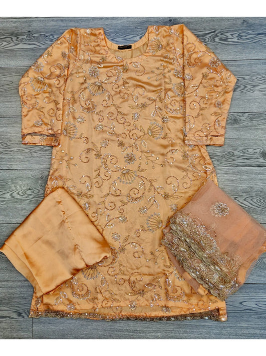 Peachy orange colour shalwar kameez in cut dana embroidery