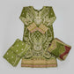 Green embroidered traditional outfit with matching dupatta on a wooden floor