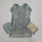 Fabric pieces with intricate patterns on a wooden surface