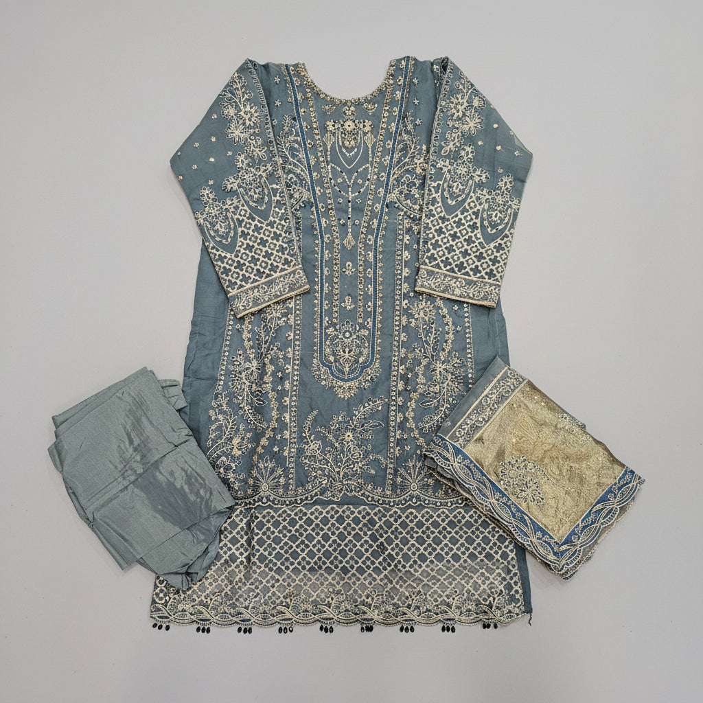 Fabric pieces with intricate patterns on a wooden surface