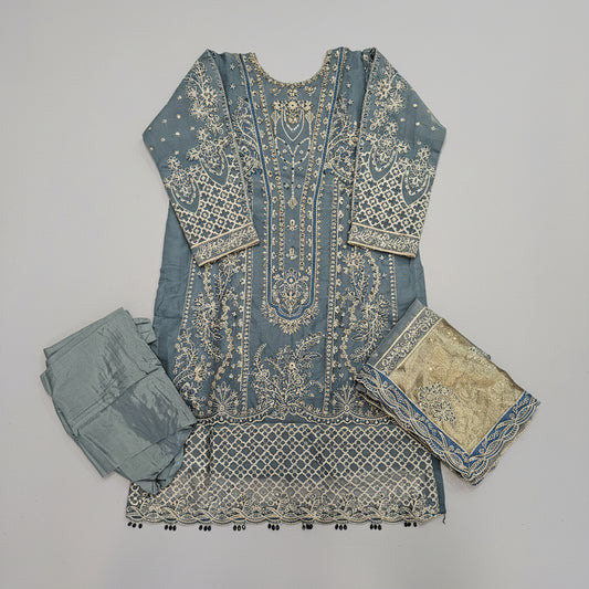 Fabric pieces with intricate patterns on a wooden surface
