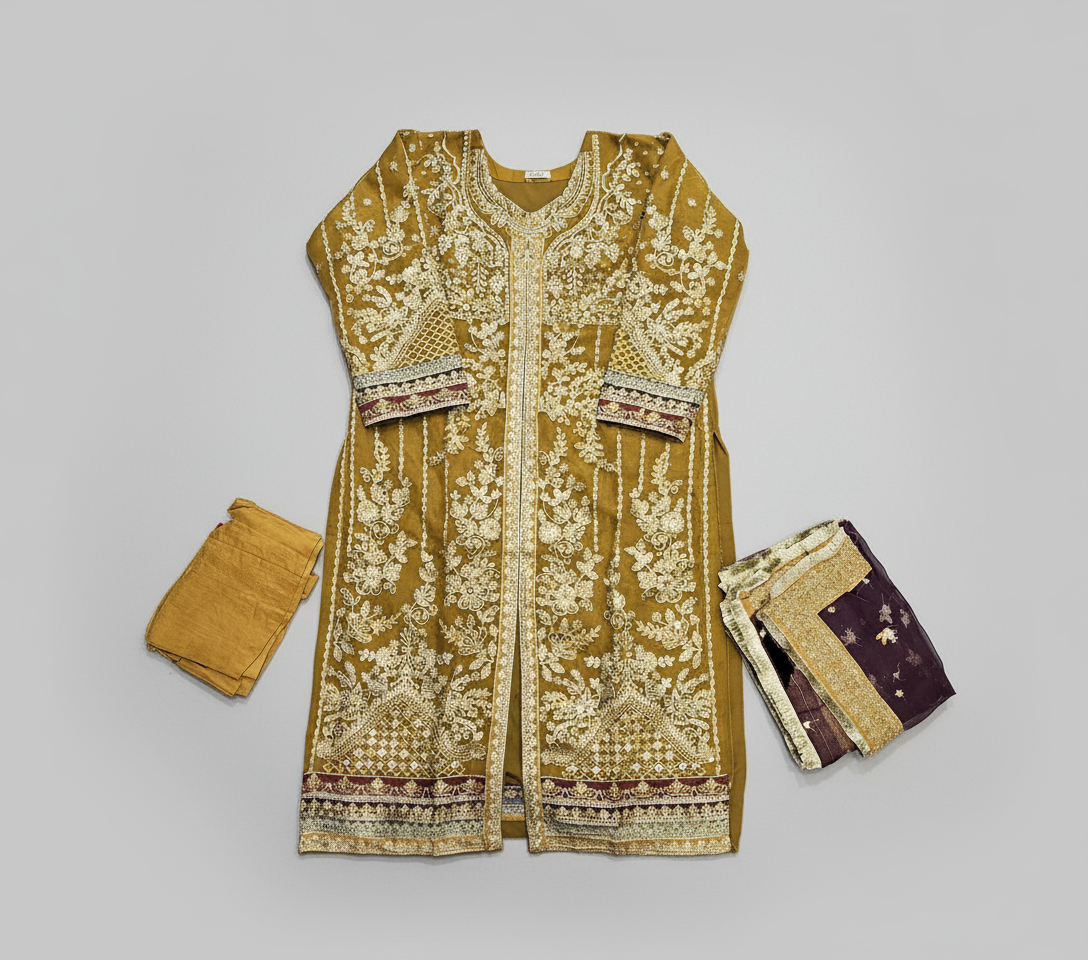 Mustard yellow embroidered traditional outfit with matching pants and dupatta on a white background
