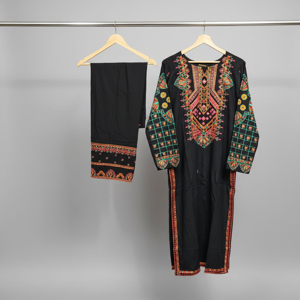 Black embroidered garment on a hanger against a patterned wall.