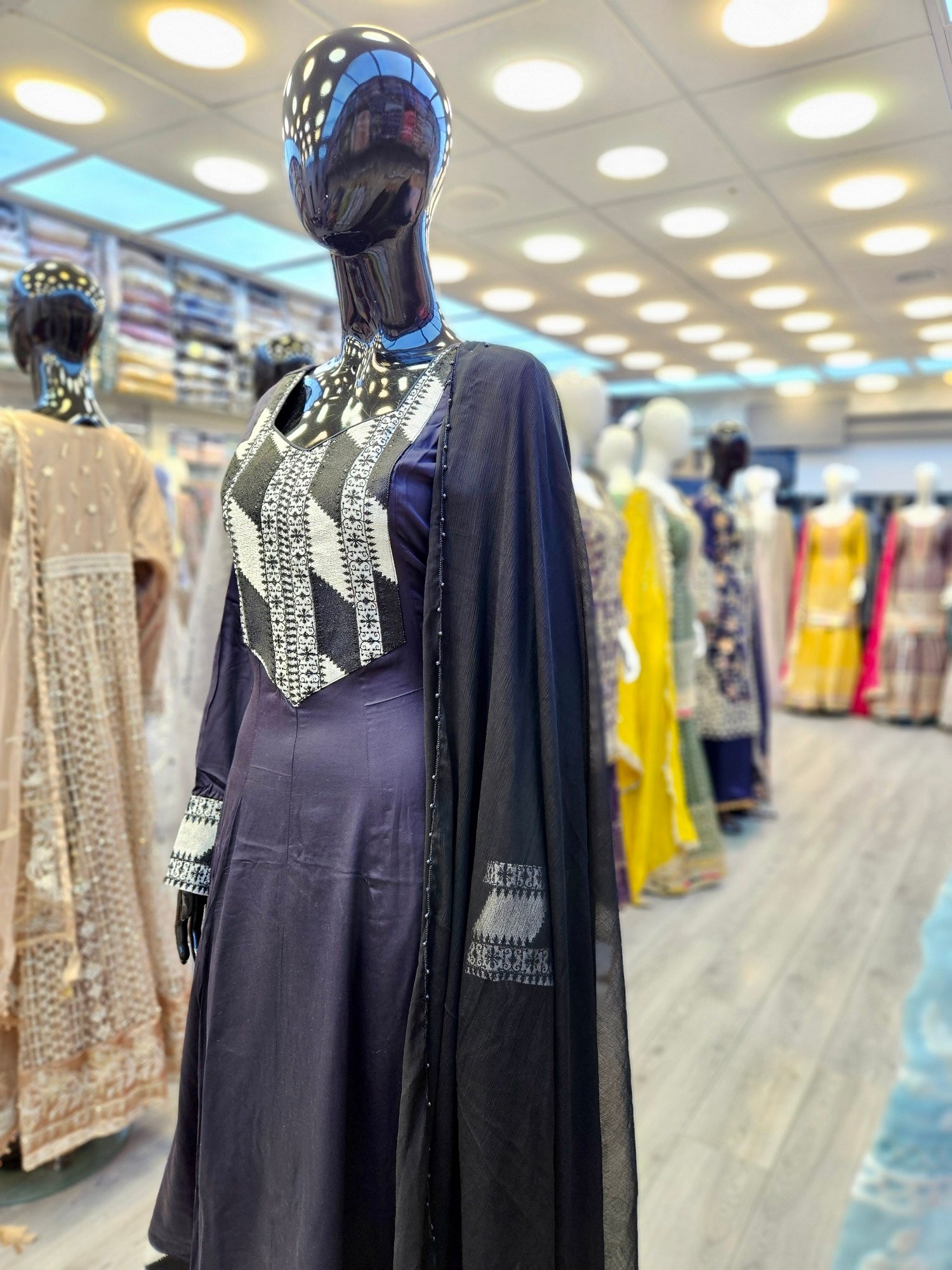 Black with white embroidery on neck and border marina winter fabric